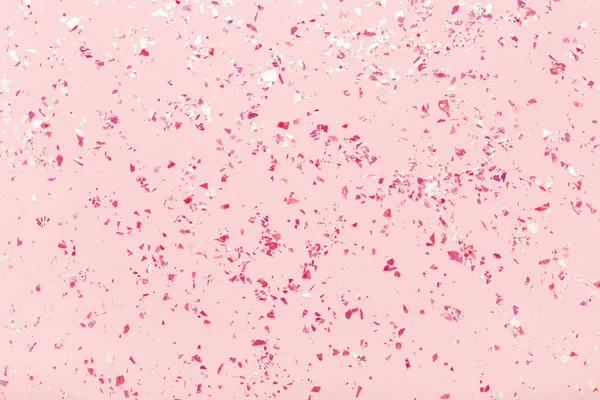 Red glitter mica sparkles on pink pastel trendy abstract background. — Stock Photo, Image