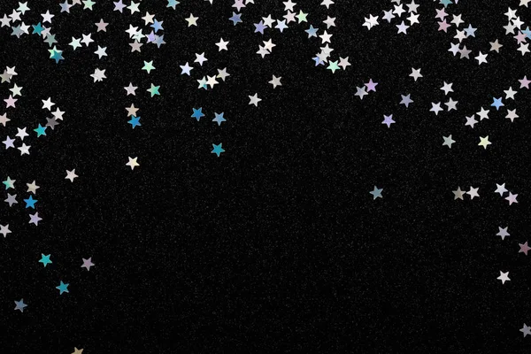 Iridescent Silver stars confetti on black festive background Glowing sparkles frame. — Stock Photo, Image