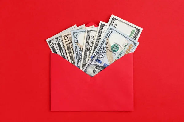 US dollars in cash in envelope on red minimal background Money mail concept