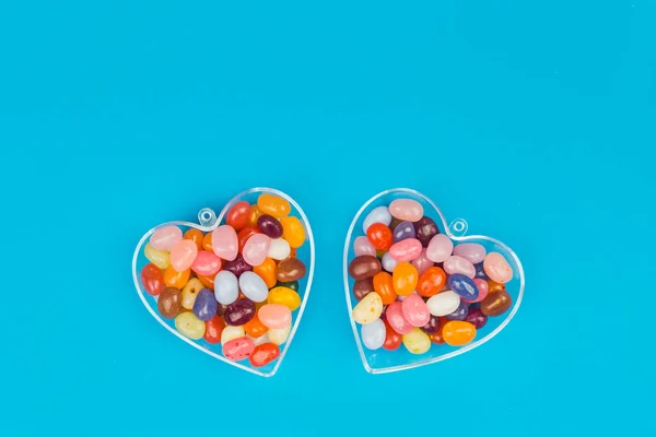 Two Hearts Colorful Candies Blue Background Flat Lay Copy Space — Stock Photo, Image