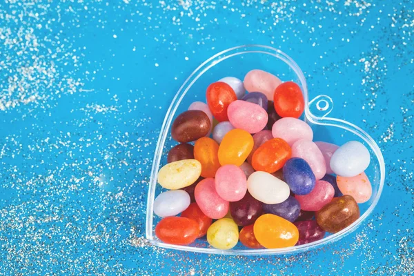 One Heart Colorful Jelly Bean Candies Blue Background Copy Space — Stock Photo, Image