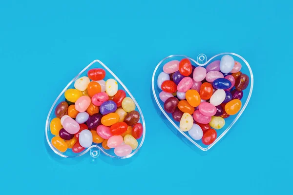 Two Hearts Colorful Candies Blue Background Flat Lay Copy Space — Stock Photo, Image