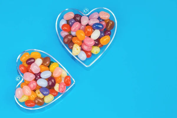 Two Hearts Colorful Candies Blue Background Flat Lay Copy Space — Stock Photo, Image