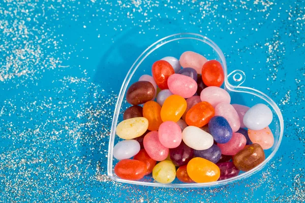 One Heart Colorful Jelly Bean Candies Blue Background Copy Space — Stock Photo, Image