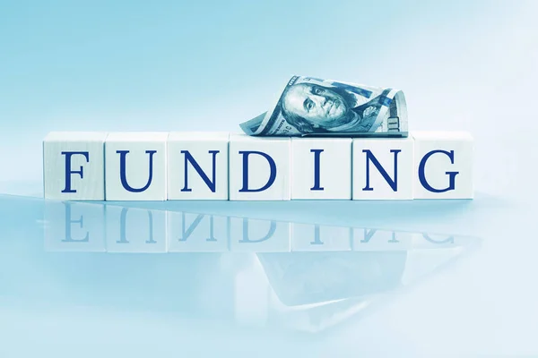 Funding text on grey background — Stock Photo, Image