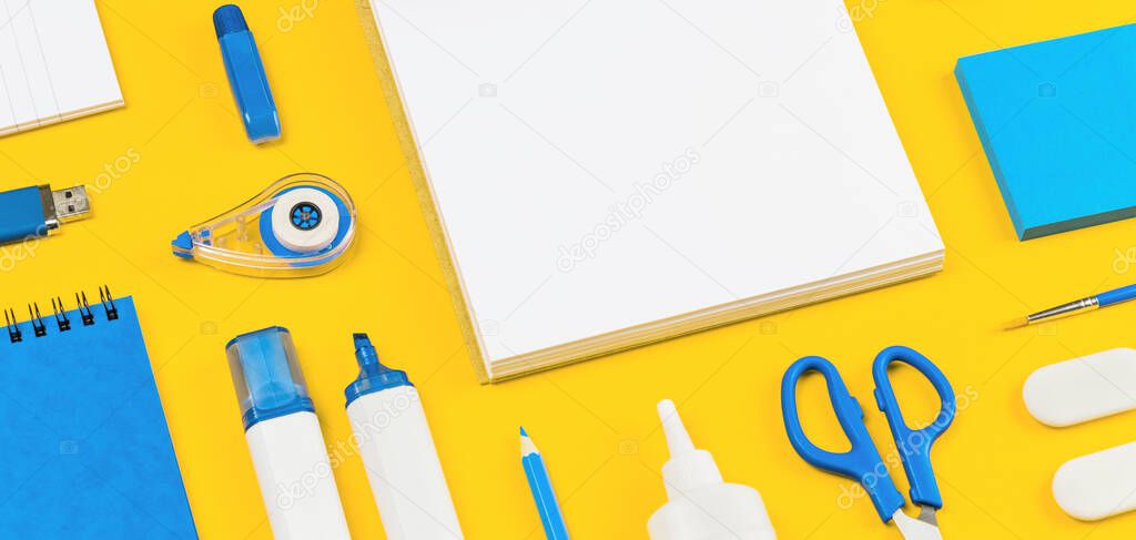 Assorted office and school white and blue stationery on bright yellow background. Organized knolling for back to school or education and craft concept. Selective focus. Banner. Copy space