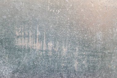 Üzerinde çizikler olan mavi demir duvar dokusu.