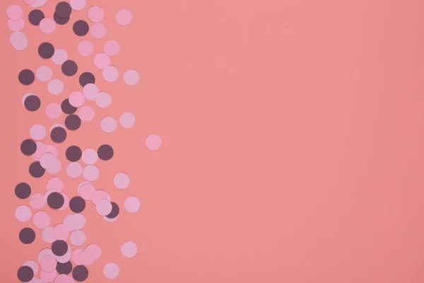 Persikofärgade bakgrund med konfetti. — Stockfoto