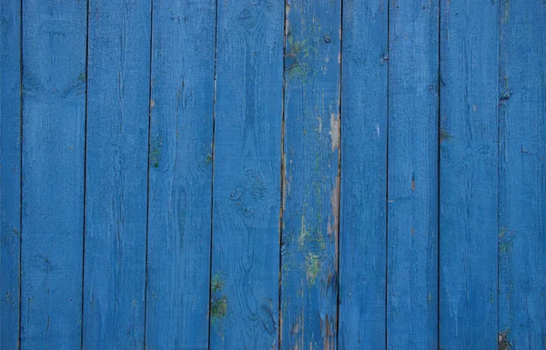 Blauer Zaun aus Holzbohlen. — Stockfoto