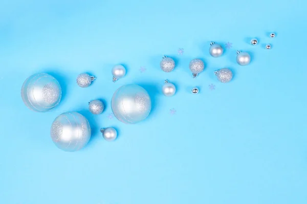 Many Beautiful Cute Silver Shiny Glittering Baubles Blue Pastel Background — Stock Photo, Image