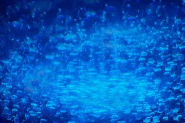 Mavi parlayan ışıklar bokeh arka plan