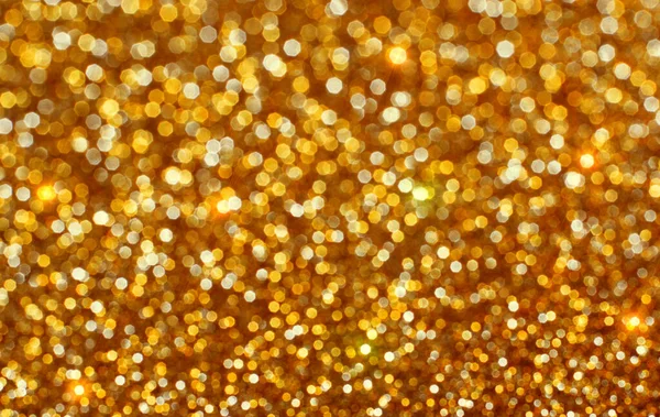 Glänzende goldene defokussierte Glitzerhintergrund. — Stockfoto
