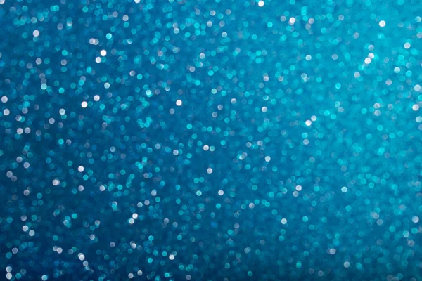 Glänsande blå defocused glitter bakgrund. — Stockfoto