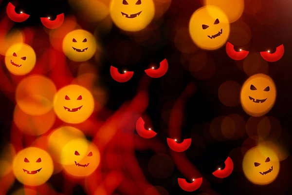 Blurry defocused bokeh lights with pumpkin faces. — Stock Photo, Image