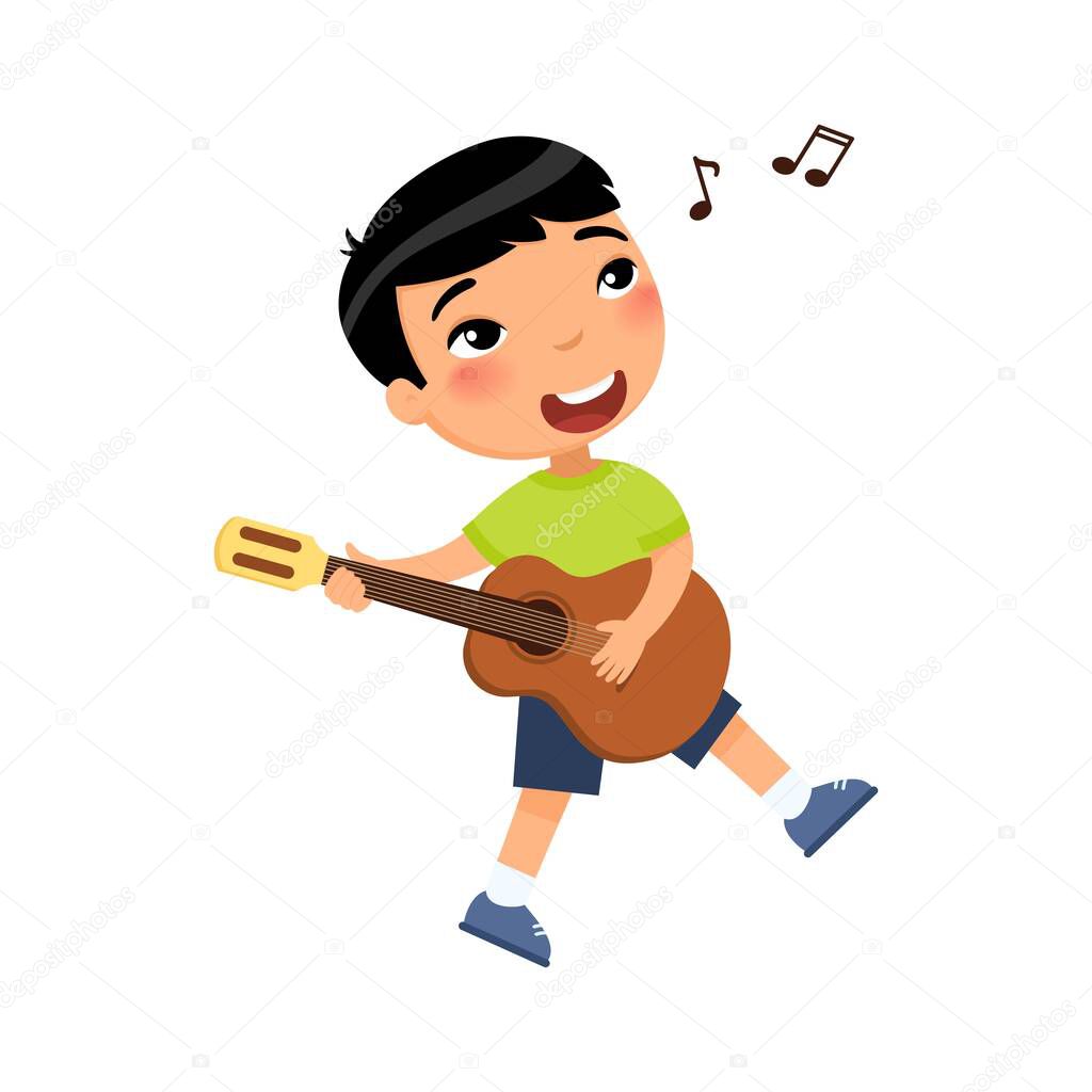 Asian boy playing guitar and singing song flat vector illustration. Young male cartoon character holding musical instrument and dancing. Talented child hobby, leisure isolated on white background