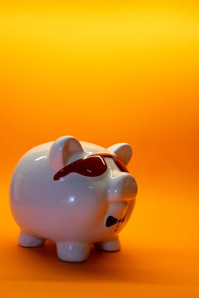 White Pig with glasses money box porcelain on background with copy space