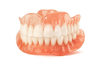 Close-up of plastic denture teeth isolate no fond background. New technologies in modern dentists. clipart