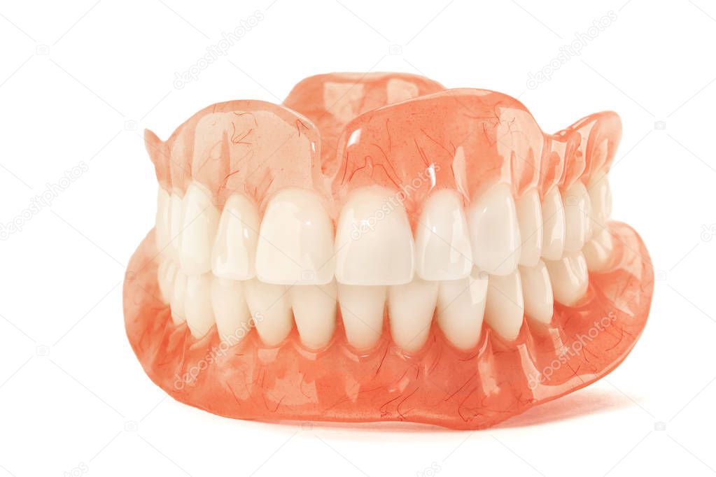 Close-up of plastic denture teeth isolate no fond background. New technologies in modern dentists.