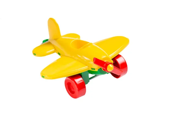 Gele speelgoed vliegtuig met propeller en landingsgestel isolaat op een — Stockfoto