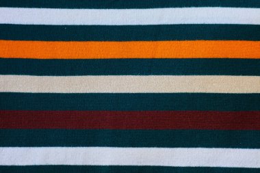 Doku sıcak örme çizgili kıyafetler. Sıcacık kış giysileri örgü arka plan