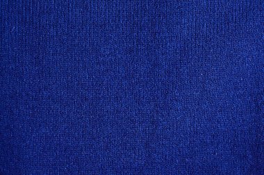 Doku sıcak mavi örme kış giysi. Rahat giysiler el yapımı örgü arka plan