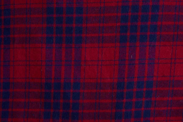 Texture of warm knitted plaid clothing. Background knitted cozy winter clothes