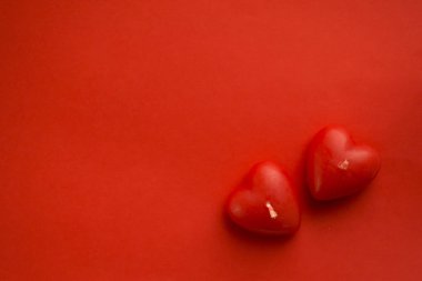 Valentines day background with red hearts on red table, top view. Red heart for valentine concept clipart