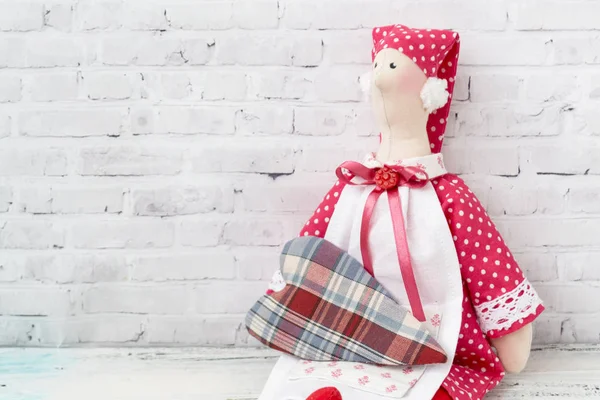 Textile doll-housewife. With handmade textile hearts. handmade doll girl tilda. Holidays decoration. Interior fairy dolls. Women friendship. Relations.
