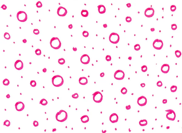 Pink circles and dots drawn by hand in the technique of dudling on a white background.
