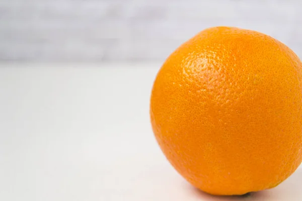 Isolated orange orange against a white background — Stock Photo, Image