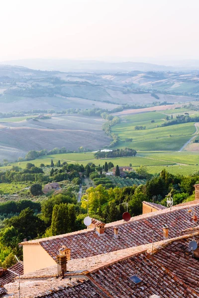 View of Tuscan Houses and Hills at Sunset near Montepulciano, Italy