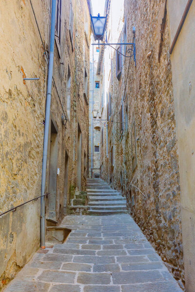 Narrow alley in the town of Cortona, Italy