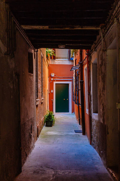 Alley and Venetian buildings in Venice, Italy