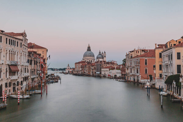 View of Grand Canal and Santa Maria della Salute church at dusk from Ponte dell'Accademia in Venice, Italy
