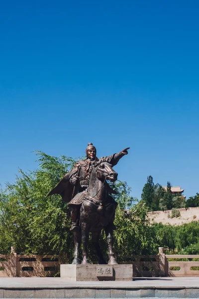 Statue of General Feng Sheng with plaque of his name at Jiayu Pass, the first frontier fortress of Ming Dynasty Great Wall of China, in Jiayuguan, Gansu, China