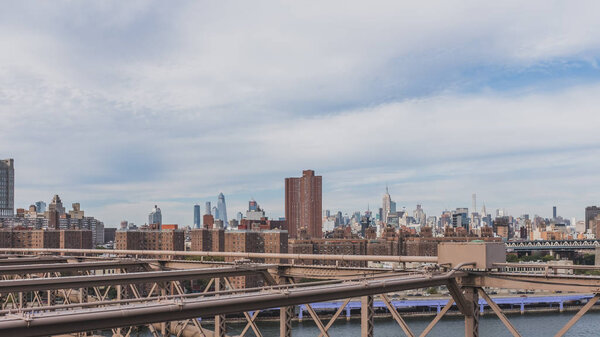 View of buildings of Manhattan from Brooklyn Bridge, in New York, USA