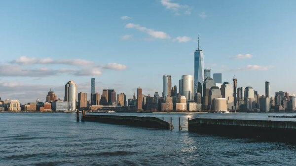 Skyline of downtown Manhattan of New York City at dusk, over Hudson River, viewed from New Jersey, USA