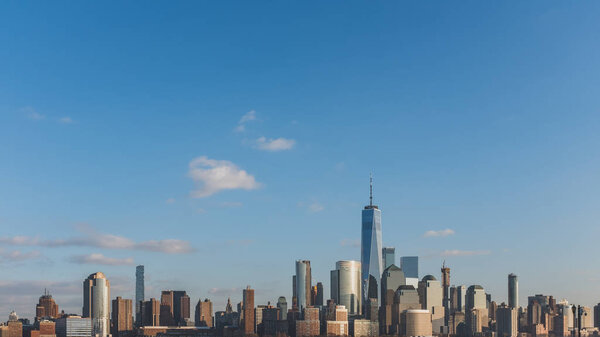 Skyline of downtown Manhattan of New York City, under blue sky, viewed from New Jersey, USA