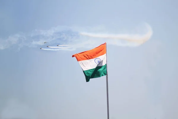 Aerobatics demonstration jet plane by team of the Indian Air Force along with Indian Flag in Bangalore India.