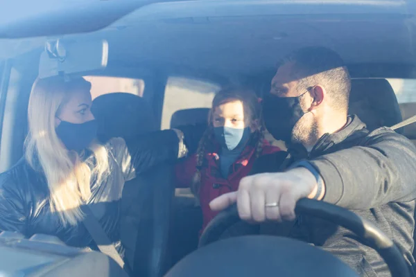 Man Wearing Surgical Mask in car. Family Wearing Surgical Mask in car.
