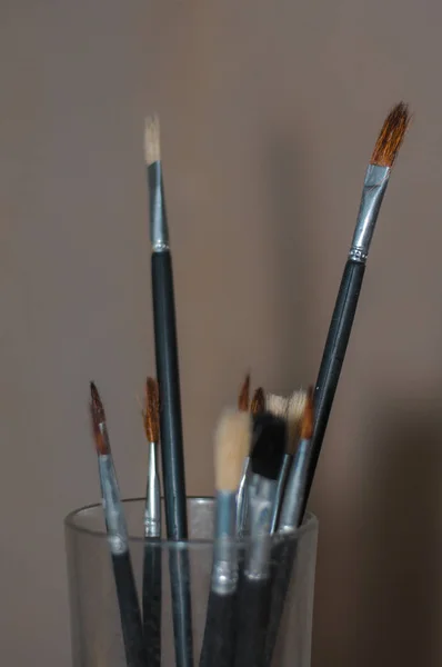 brushes to paint, of different thicknesses with oils of colors