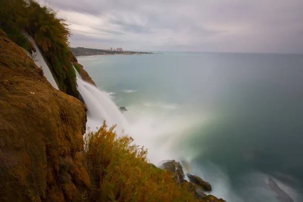 Lower Duden waterfalls on Mediterranean sea coast, Antalya, Turkey, in sunset light