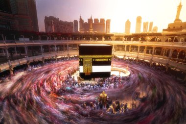 Muslim pilgrims, from all around the World, touring around the Kaaba at night during Hajj in Saudi Arabia. Exposed long to capture the motion blur. clipart