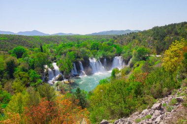 The Kravice Falls, a Miracle of Nature in Bosnia and Herzegovina. The Kravice waterfalls, originally known as the Kravica waterfalls, is one of the most beautiful natural sites in the Herzegovinian clipart