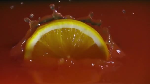 Slow Motion Orange Falling Water Splashing — Stock Video