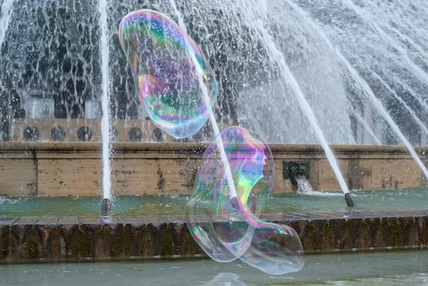 Soap bubbles in fountain, Genoa, Italy