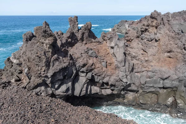 Sea and volcanic lava rocks at the Los Hervideros west coast of Lanzarote island, Spain