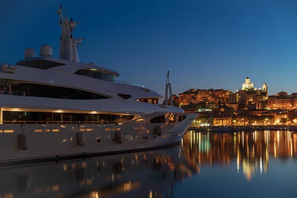 Luxury yachts in Imperia harbor at night — Stock Photo, Image