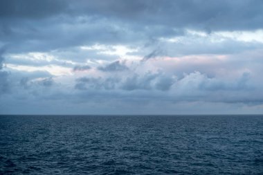 Mediterranean sea under cloudy sky clipart