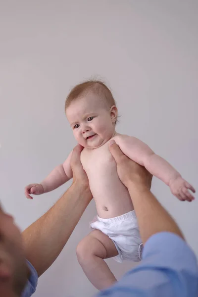 Father Holding Baby Girl Months Aloft Home Low Angle View — Stock Photo, Image